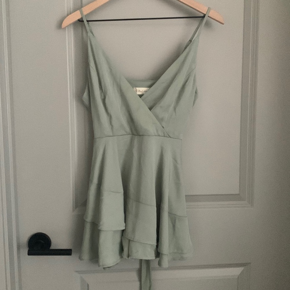 Never worn. New Xs desert-sage color romper.